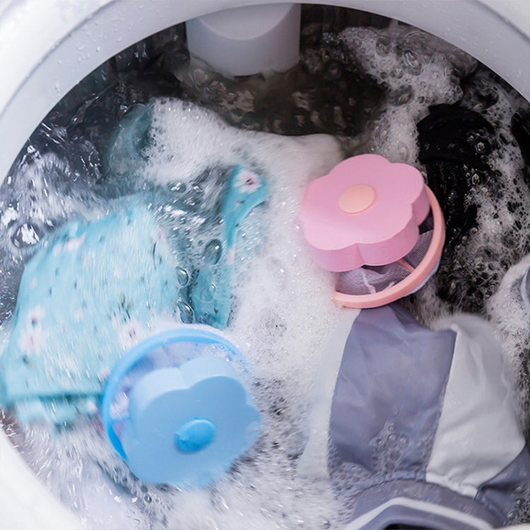 Two flower-lid filter net bags in washer water, blue and pink mesh pouches