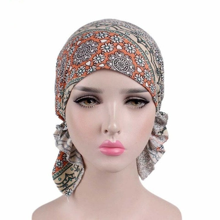 Orange floral paisley stretch turban cap with ruched side scarf ties