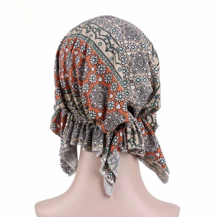Orange and brown paisley floral stretch turban cap with gathered back and ties