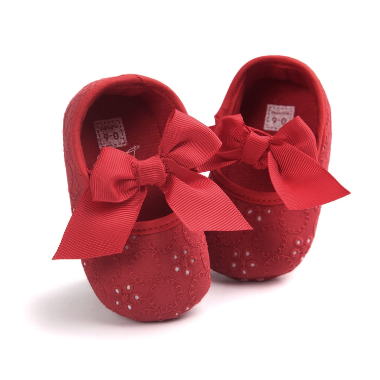 Toddler princess shoes in red with large ribbon bow, textured fabric upper, soft sole