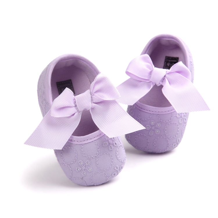 Toddler princess shoes in lavender with large white bow, textured upper, soft sole