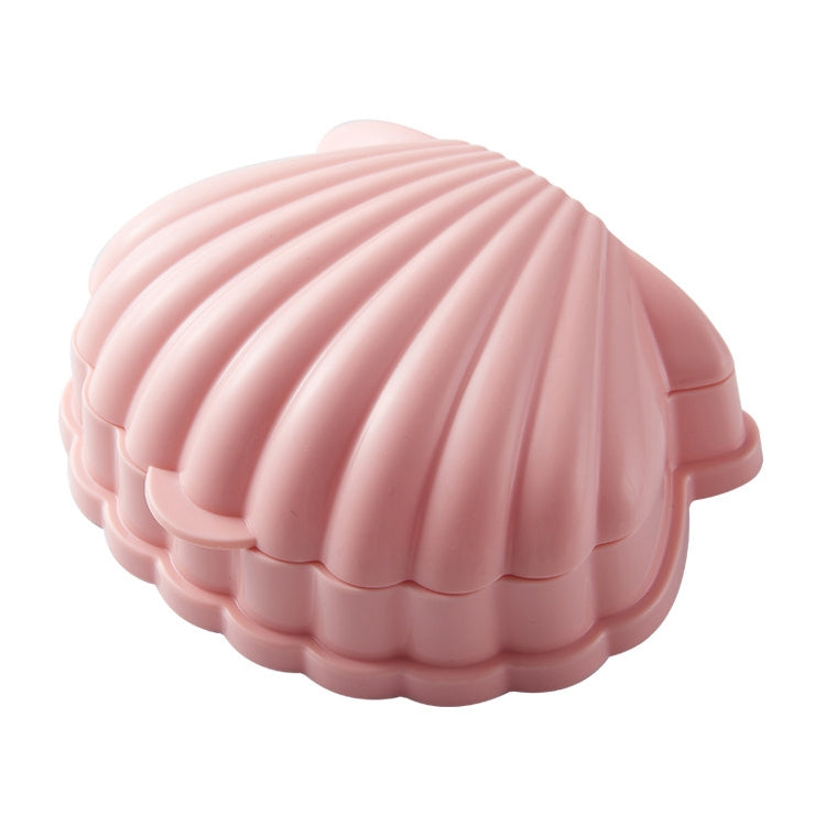 Pink seashell-shaped flip-top soap box with scalloped edges and hinge lid