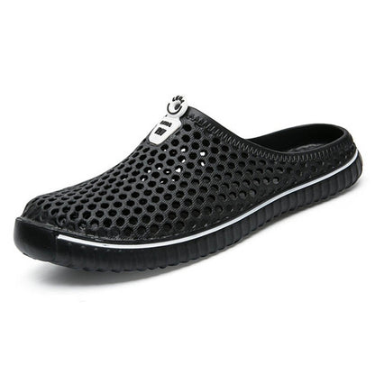 Black breathable hollow slip-on sandals with perforated upper and cushioned sole
