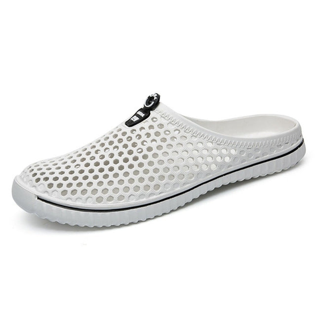 White hollow beach sandals, slip-on clog with black logo strap and textured rubber sole
