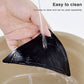 Black triangular non-slip bath mat sticker on floor, water rinse visible over texture.