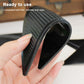 Black triangular non-slip mat sticker roll-up close-up showing textured underside grip.