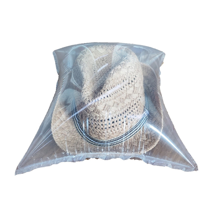 Children's straw panama hat in clear protective bag with blue striped band
