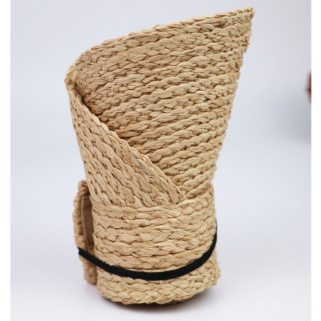 Woven straw visor hat side profile with layered straw texture and brim seam.