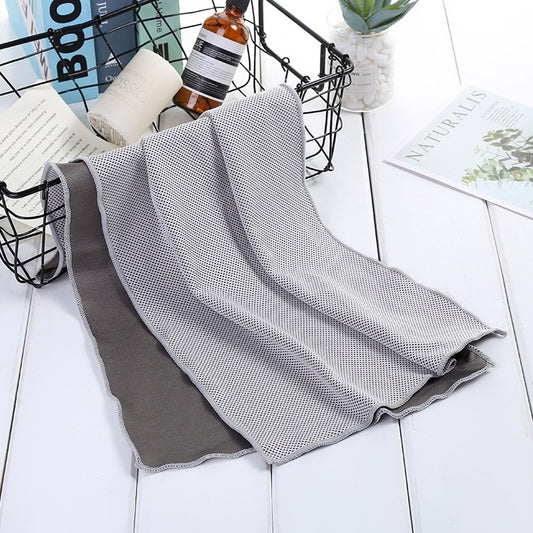 Gray and dark gray honeycomb cooling towel, folded with stitched edges