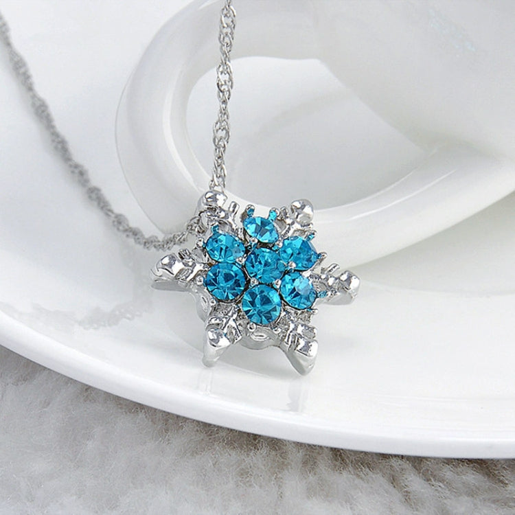Silver-tone necklace with blue crystal snowflake flower pendant on chain