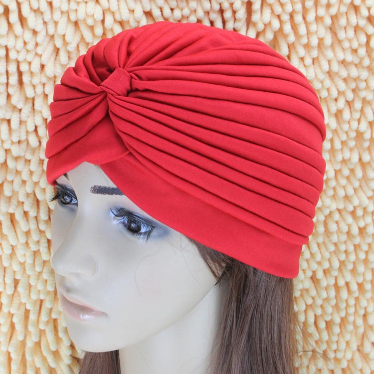 Red draped turban head wrap with gathered stripes and front knot