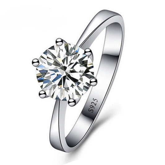 Silver-tone solitaire ring with a large round cubic zirconia in a six-prong setting.