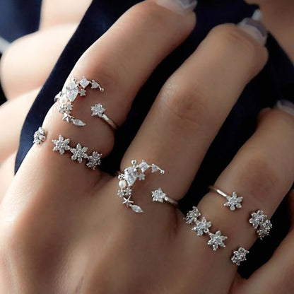 Star and moon adjustable ring set in silver tone with crystal-like stones on fingers