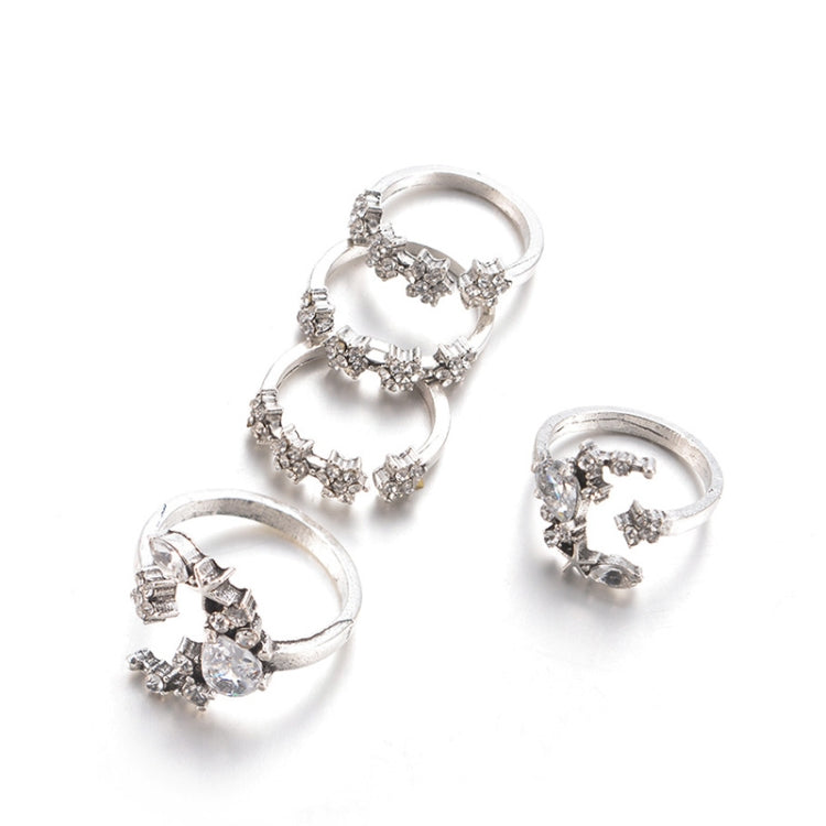 Five silver-tone adjustable rings with star/moon motifs and sparkling stones