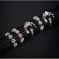 Star and moon adjustable rings with crystal-like stones in silver tone, side view set