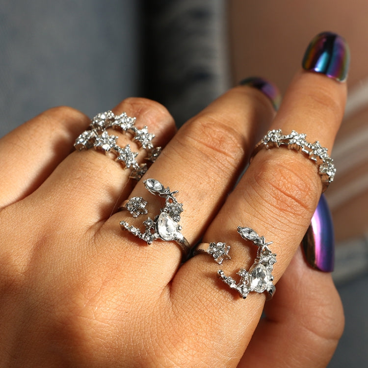 Five star and moon adjustable rings in silver tone with crystal-like stones on hand