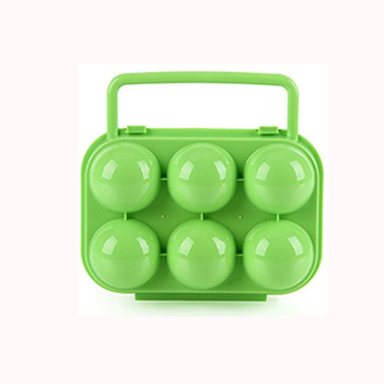 Green 6-egg plastic egg storage case with handle, closed with 6 eggs inside