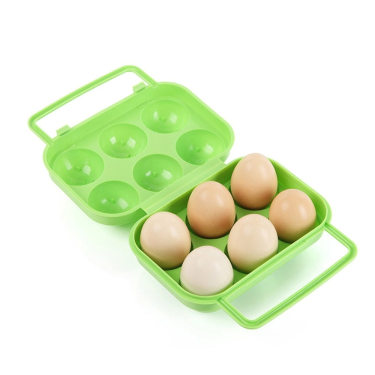 Green plastic 6-egg container case with handle, open tray holding 6 eggs