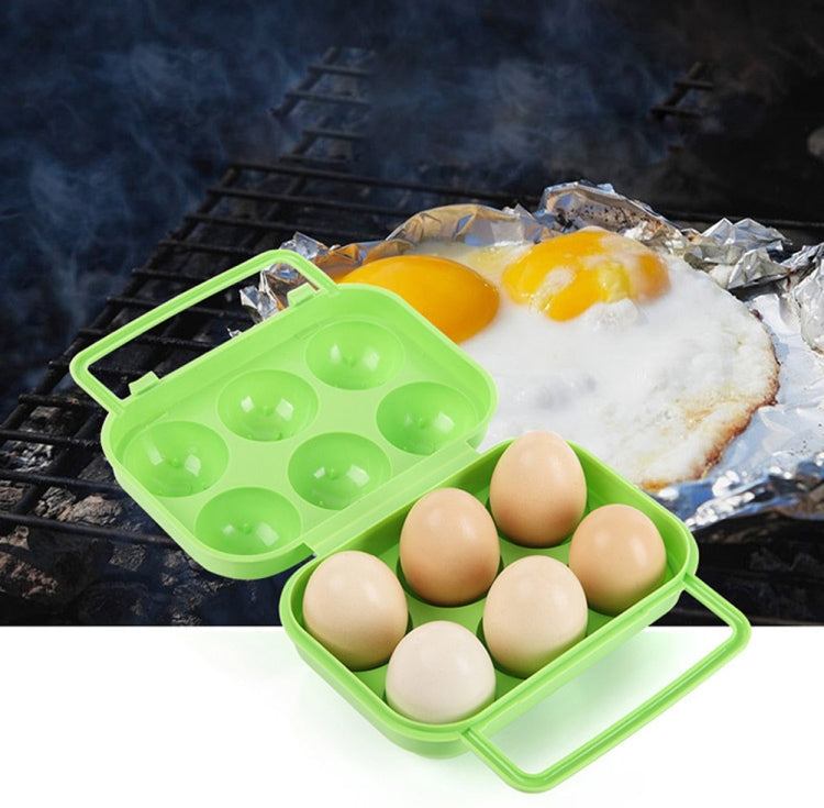 Green plastic 6-egg storage container case, open with eggs in tray