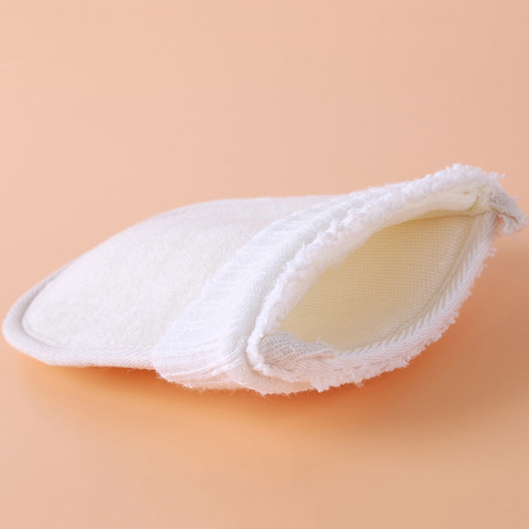 Natural loofah scrub mitt folded open, showing soft beige interior