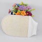 Natural loofah bath glove with beige loofah pad and ribbed white knit cuff