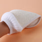 Natural loofah bath glove rolled view with ribbed white cuff and textured scrub pad