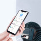 USB fan lamp with dark housing and circular power control, used with smartphone