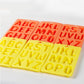 Letter ice cube tray set with orange and yellow A–Z molds