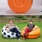 Orange inflatable lounge chair with black panel seams