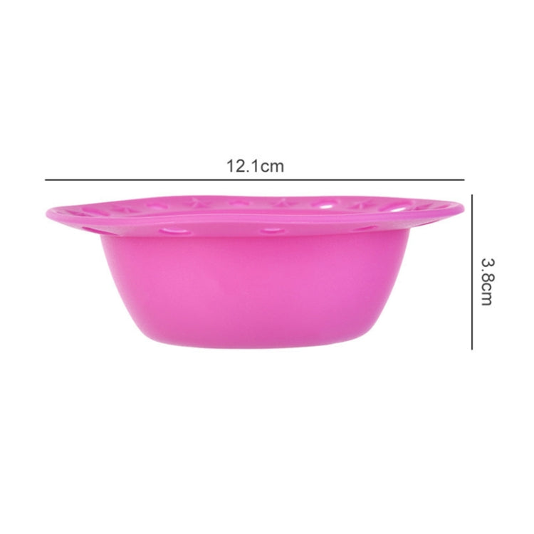 Pink silicone makeup brush cleaning bowl with star-pattern rim and textured pad.