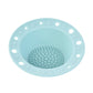 Light blue silicone makeup brush cleaning bowl with central textured scrubbing pad and rim holes.
