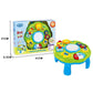 Green musical learning table toy shown with retail box and colorful activity keys