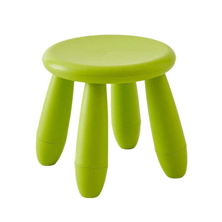 Green plastic children’s stool with a round seat and three short legs