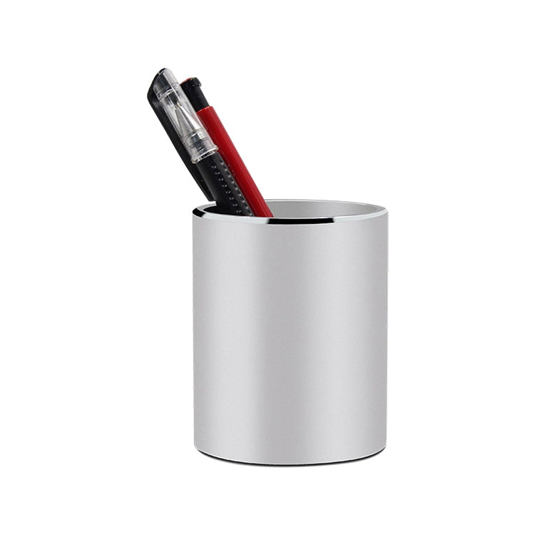 White round metal pencil holder with red and clear pens inside