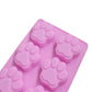 Pink silicone paw-print soap mold with four raised paw cavities