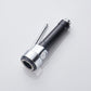 Black and chrome handheld faucet nozzle with round spray face and side lever