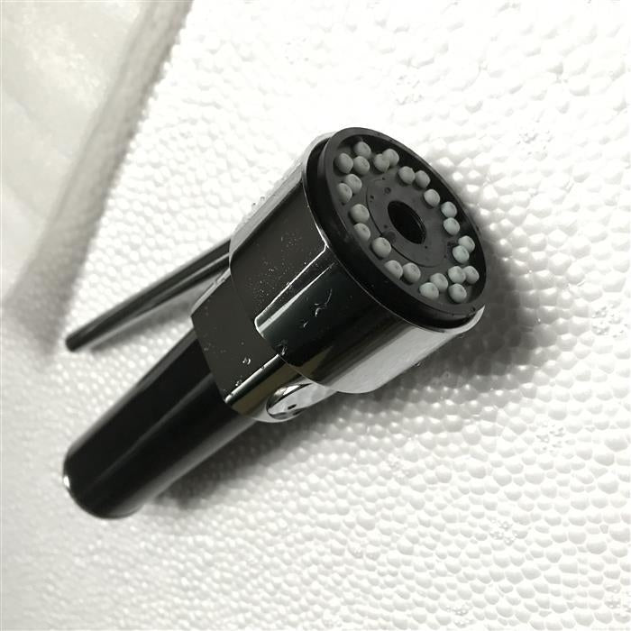 Black handheld faucet spray head with round nozzle face and control lever