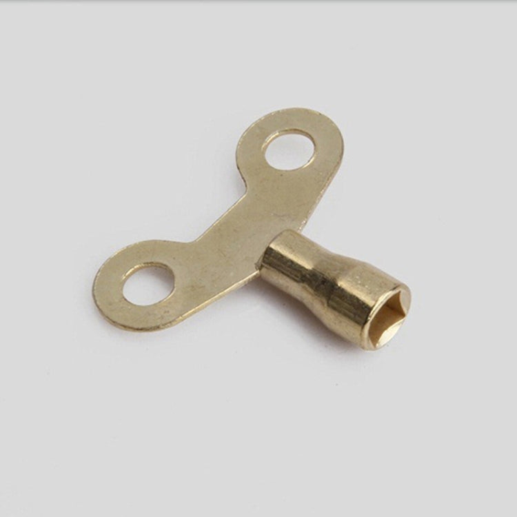 Solid brass faucet lock key with two circular holes and square socket end
