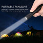 Black portable penlight LED flashlight held by a hand