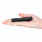 Black mini penlight LED flashlight shown in an open palm