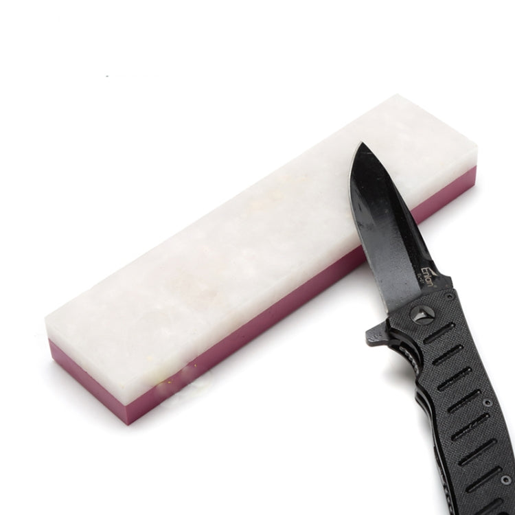 Double-sided knife sharpener with black handle and white sharpening stone
