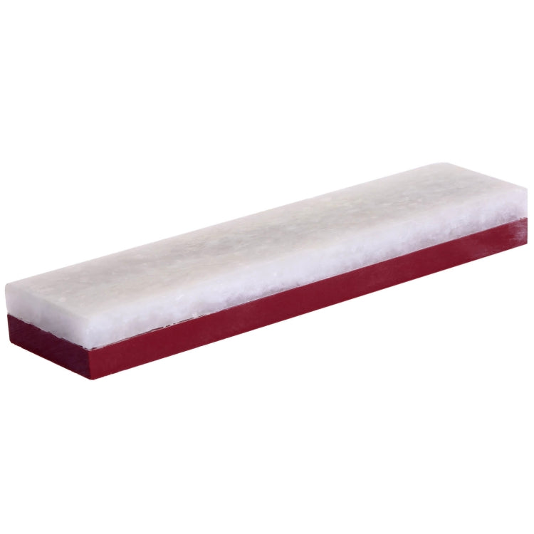 White sharpening stone with maroon base strip, long edge profile