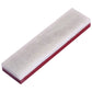 White sharpening stone with maroon backing strip, close-up