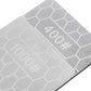 Close-up of gray whetstone plates with embossed 400# and 1000# labels