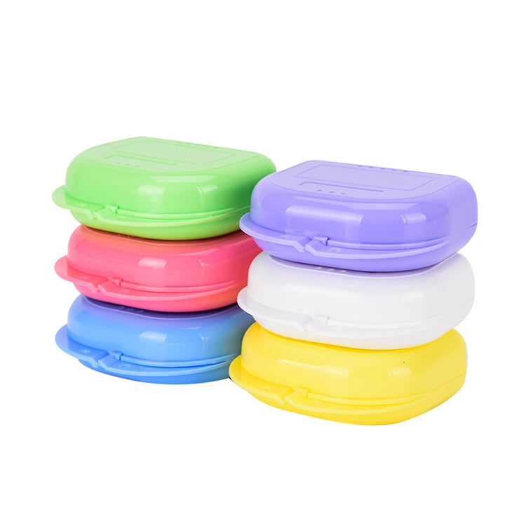 Assorted perforated storage boxes in green, purple, pink, blue, yellow