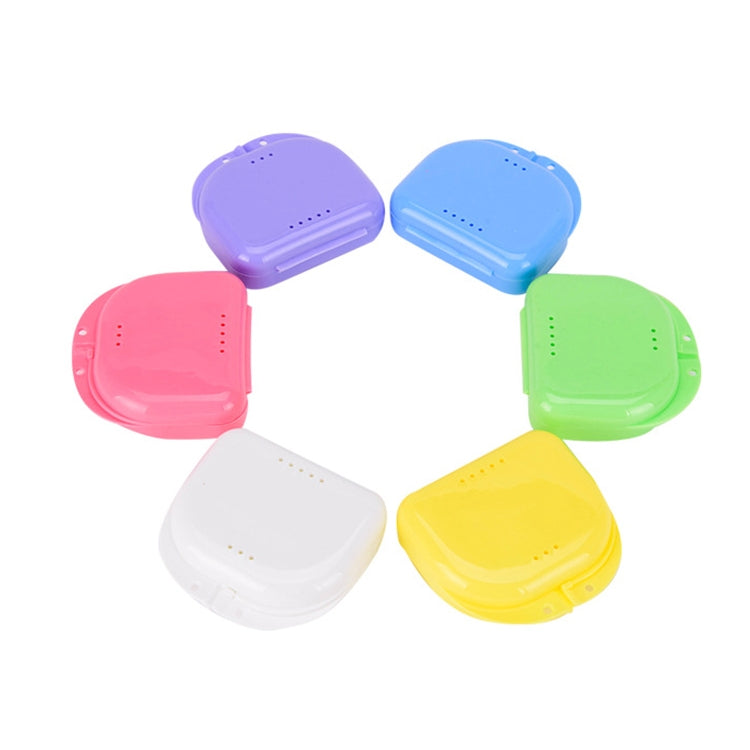 Assorted small plastic storage boxes with perforated ventilation holes