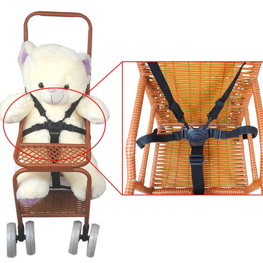 Black five-point stroller harness with chest and waist straps, shown attached.