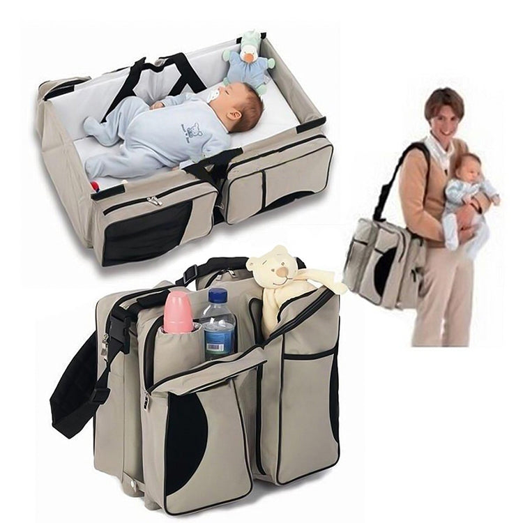 Beige and black portable baby travel foldable bed bag with built-in infant bed and side storage