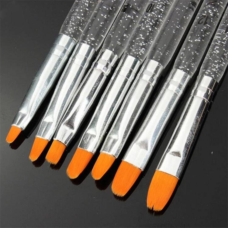 Close-up nail art brush pens with clear glitter handles, orange bristles, and silver rings