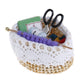 Mini dollhouse knitting tool basket with black scissors and multicolor yarn in white lace